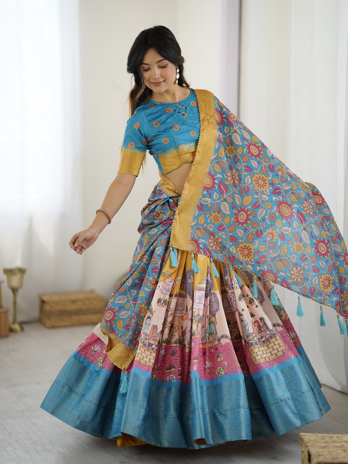 Elegant kalamkari lehenga in blue and peach with floral dupatta and flared skirt