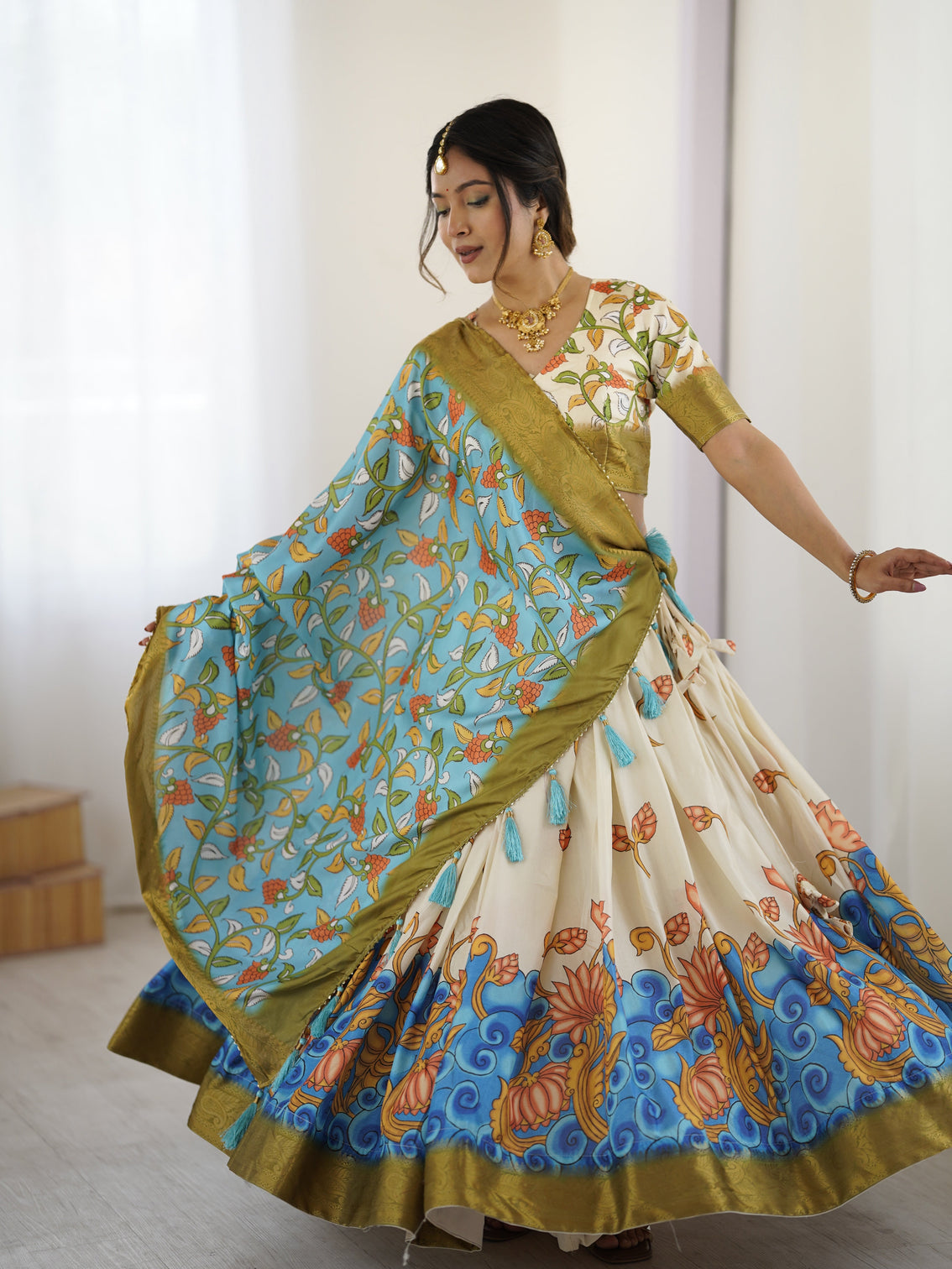 Off white blue kalamkari silk lehenga with olive zari border tassel dupatta festive wedding wear