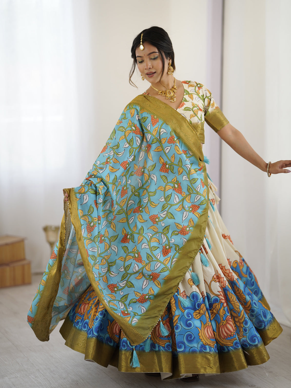 Off white blue kalamkari silk lehenga with olive zari border tassel dupatta festive wedding wear mameraa