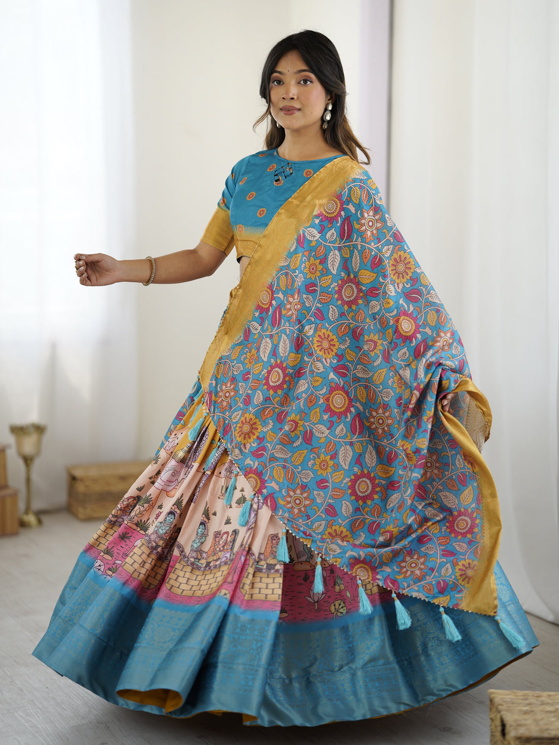 Elegant kalamkari lehenga in blue and peach with floral dupatta and flared skirt