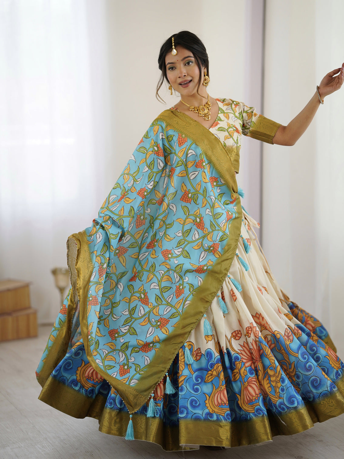 Off white blue kalamkari silk lehenga with olive zari border tassel dupatta festive wedding wear