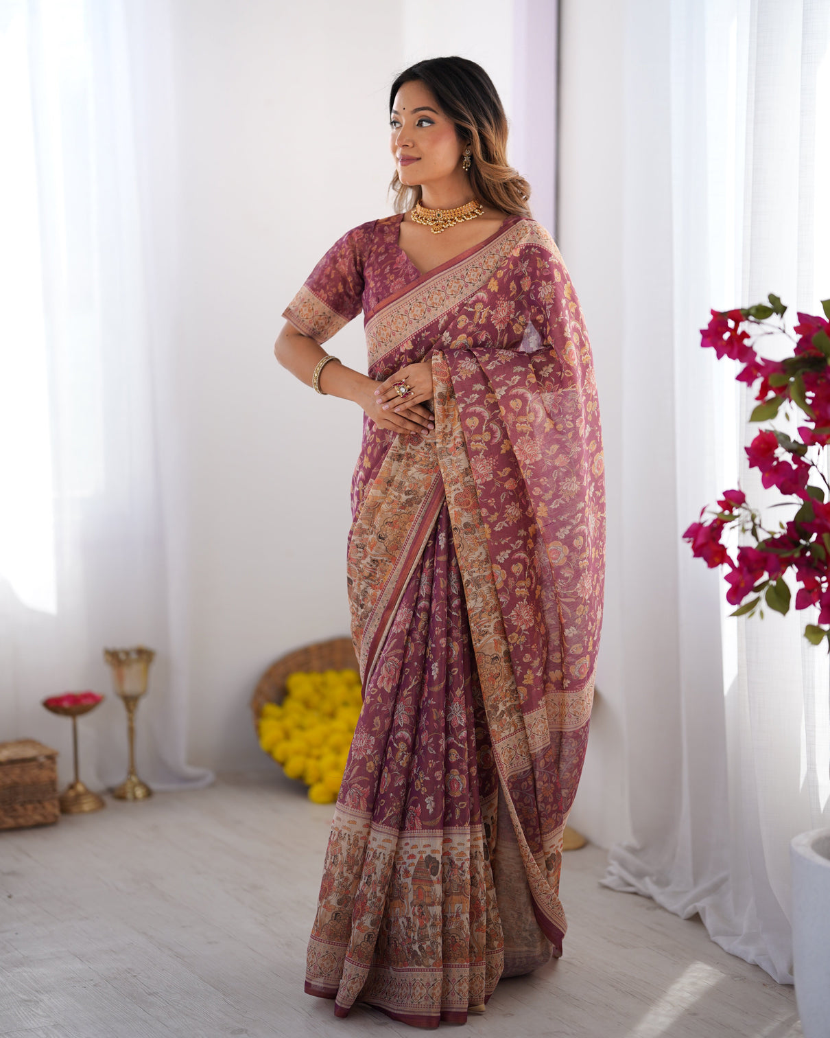 Plum handloom cotton saree with floral print mythical border tassels