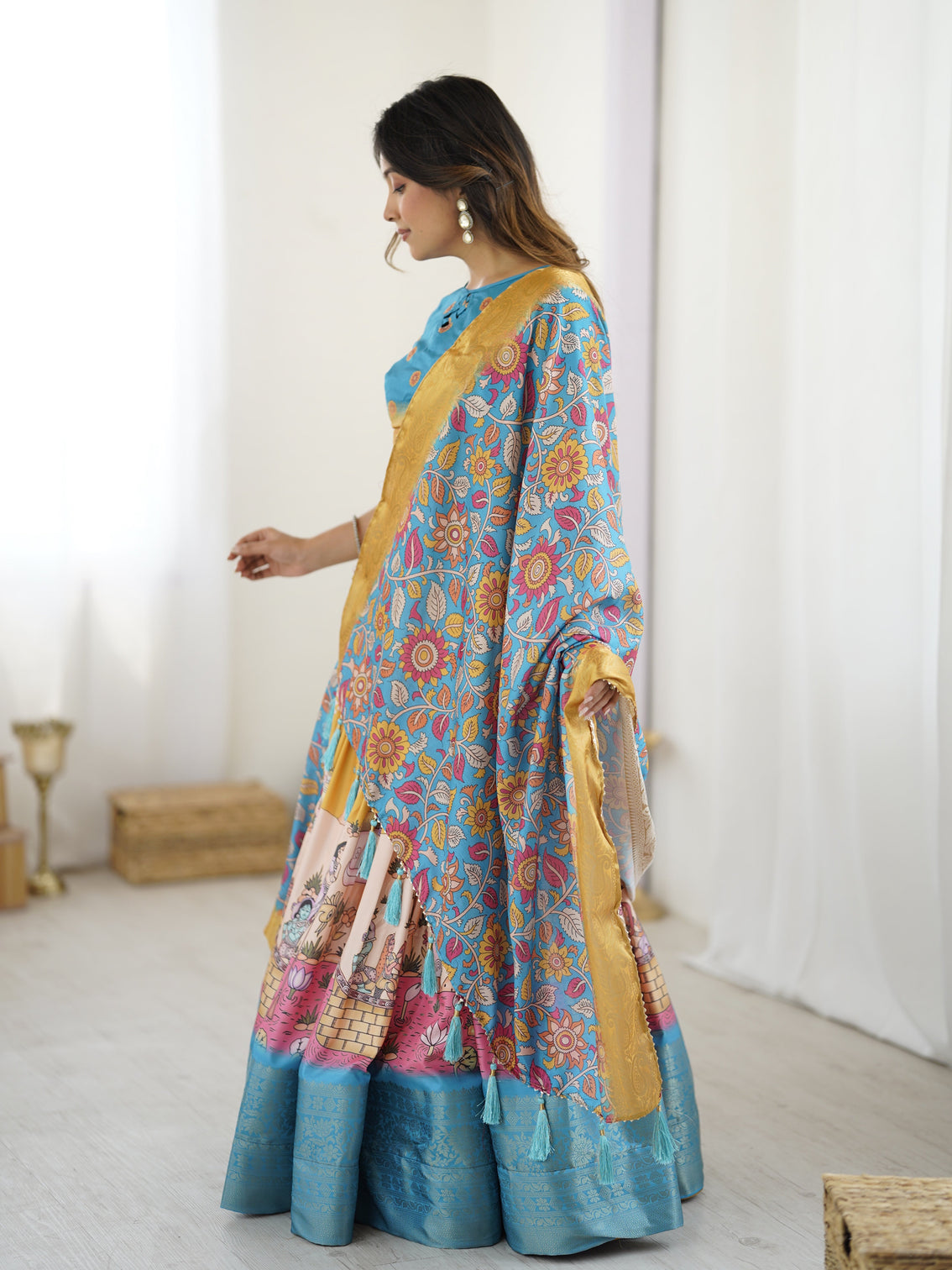 Elegant kalamkari lehenga in blue and peach with floral dupatta and flared skirt