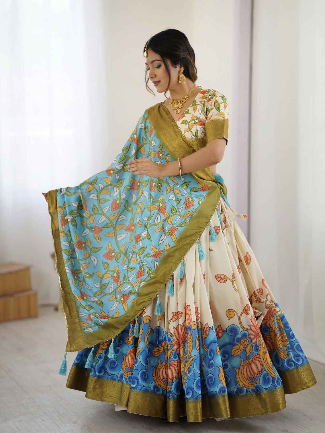 Off white blue kalamkari silk lehenga with olive zari border tassel dupatta festive wedding wear