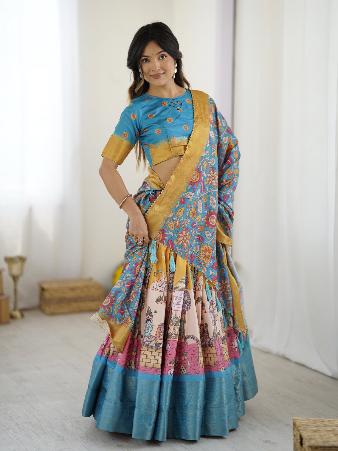Elegant kalamkari lehenga in blue and peach with floral dupatta and flared skirt