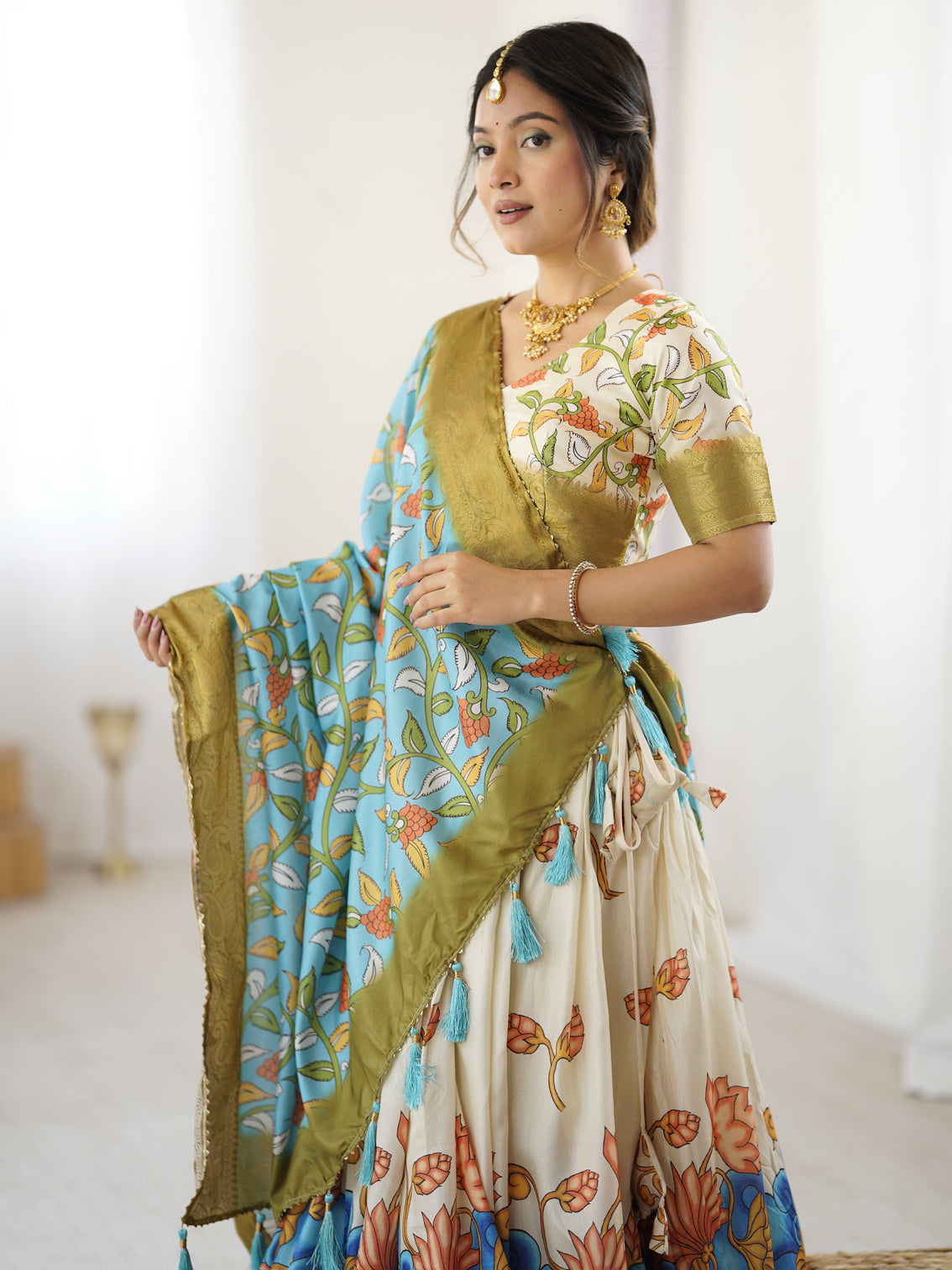 Off white blue kalamkari silk lehenga with olive zari border tassel dupatta festive wedding wear
