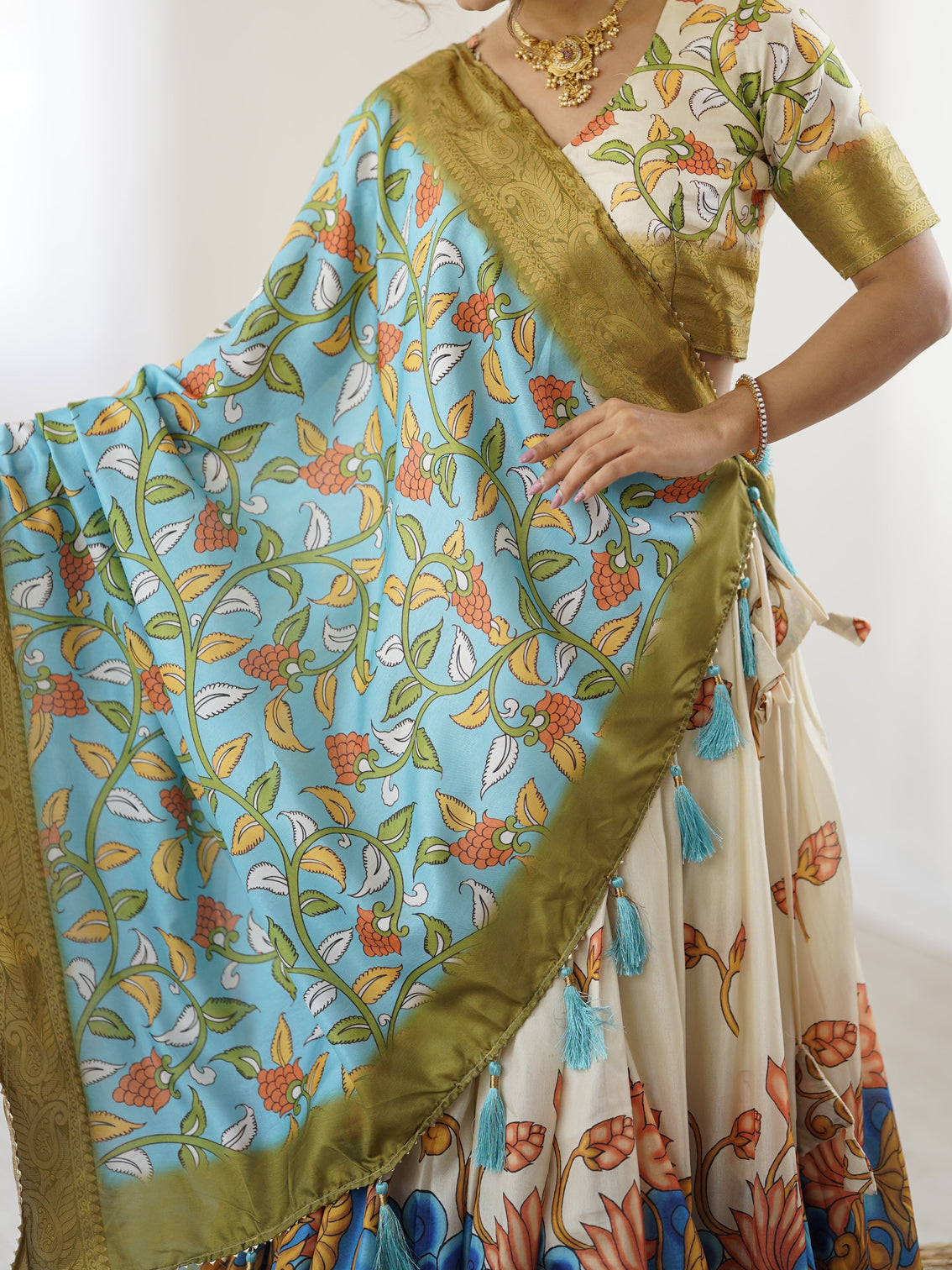 Off white blue kalamkari silk lehenga with olive zari border tassel dupatta festive wedding wear