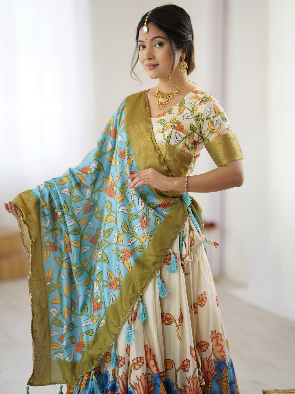 Off white blue kalamkari silk lehenga with olive zari border tassel dupatta festive wedding wear