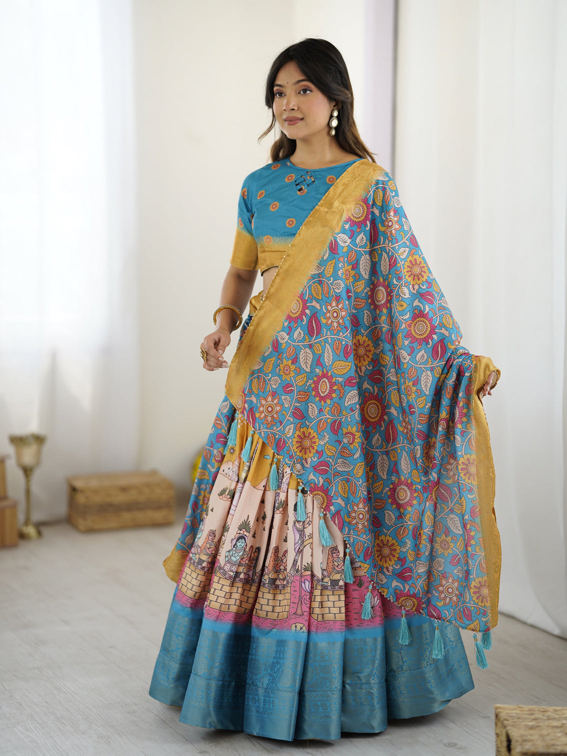 Elegant kalamkari lehenga in blue and peach with floral dupatta and flared skirt