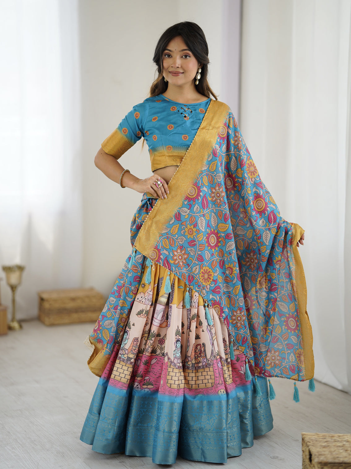 Elegant kalamkari lehenga in blue and peach with floral dupatta and flared skirt