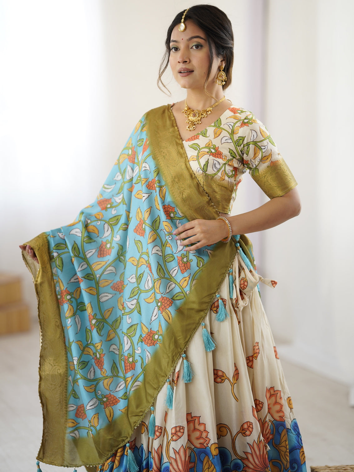 Off white blue kalamkari silk lehenga with olive zari border tassel dupatta festive wedding wear