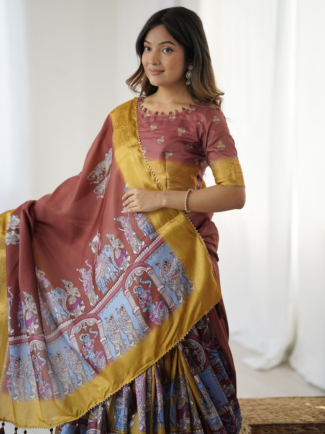 Elegant kalamkari lehenga in maroon and mustard with flared skirt and dupatta