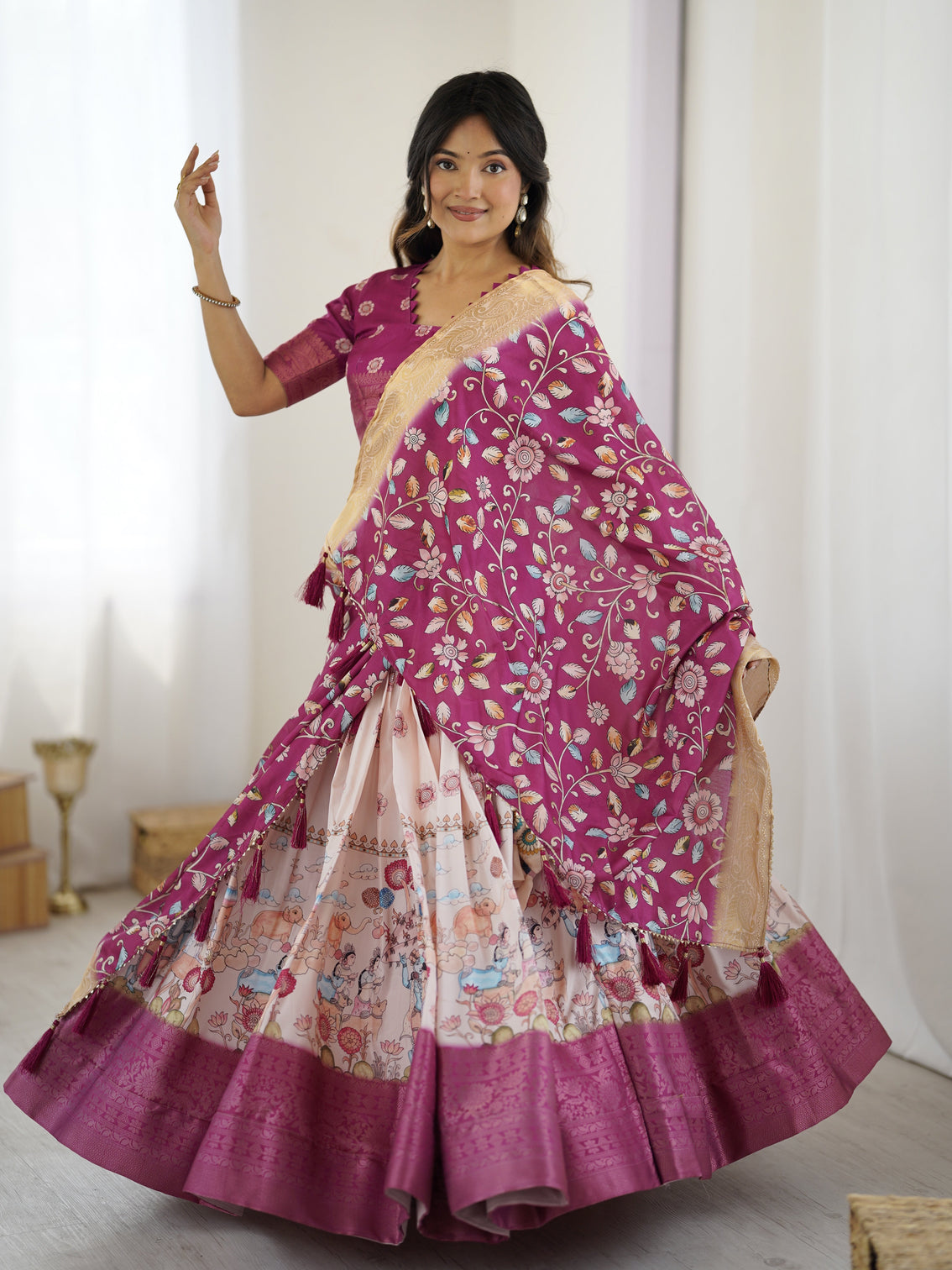 Elegant kalamkari lehenga in wine and peach with divine print and floral zari dupatta