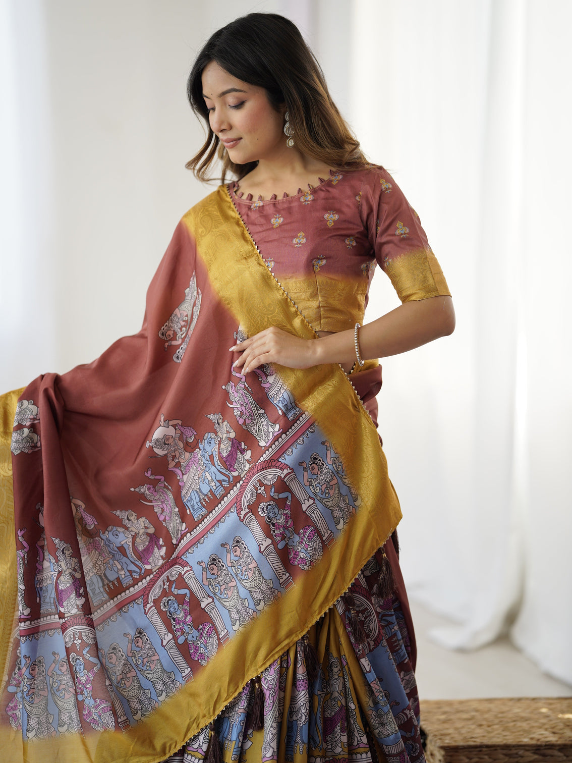 Elegant kalamkari lehenga in maroon and mustard with flared skirt and dupatta