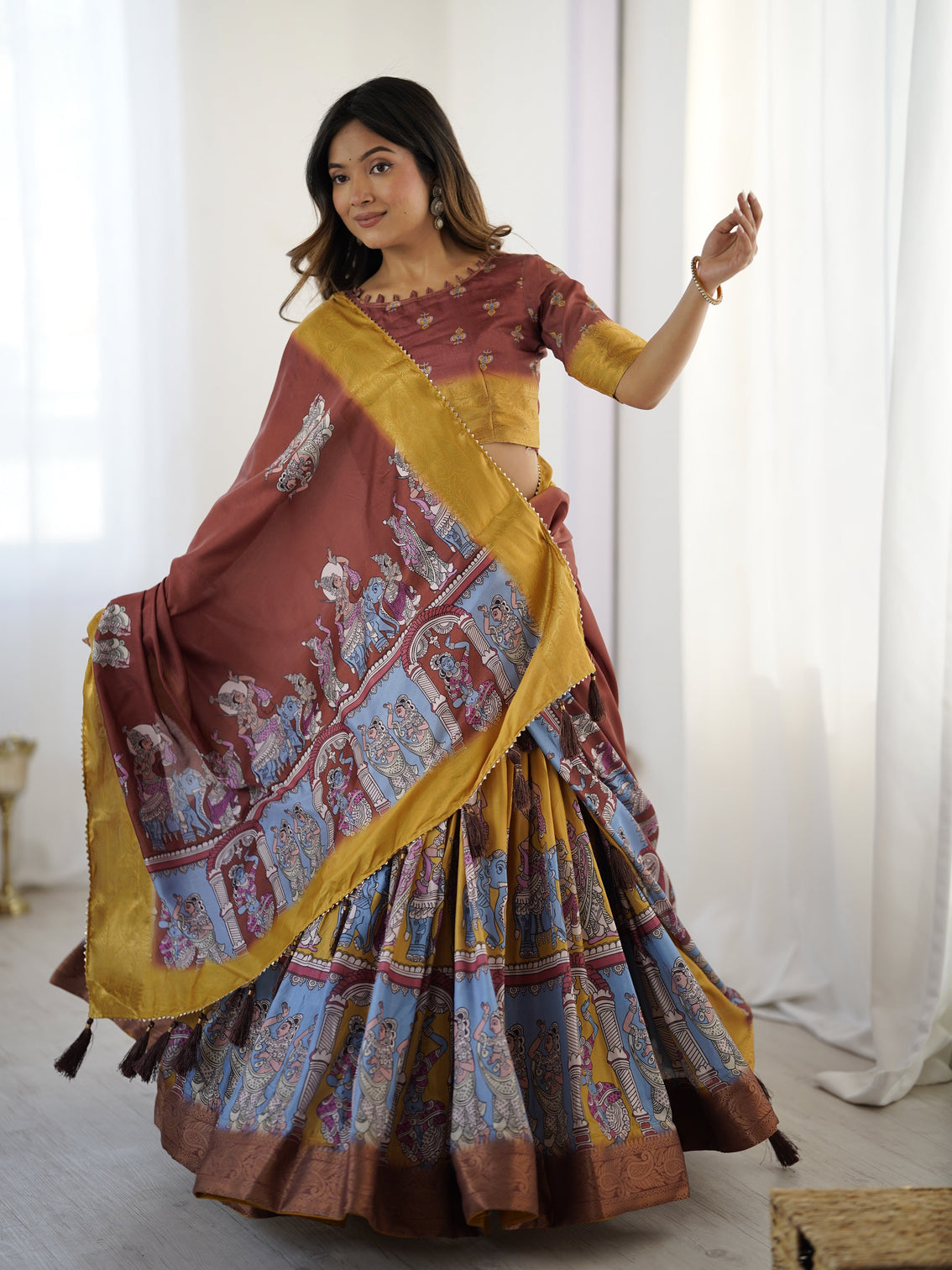 Elegant kalamkari lehenga in maroon and mustard with flared skirt and dupatta