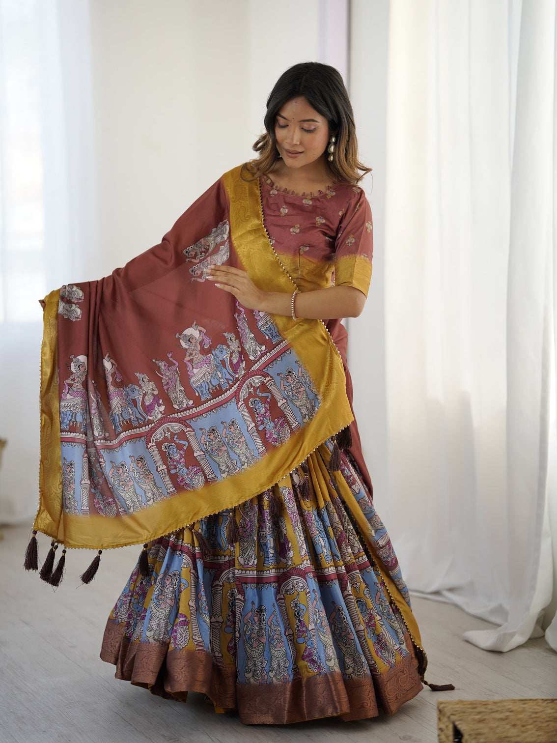 Elegant kalamkari lehenga in maroon and mustard with flared skirt and dupatta