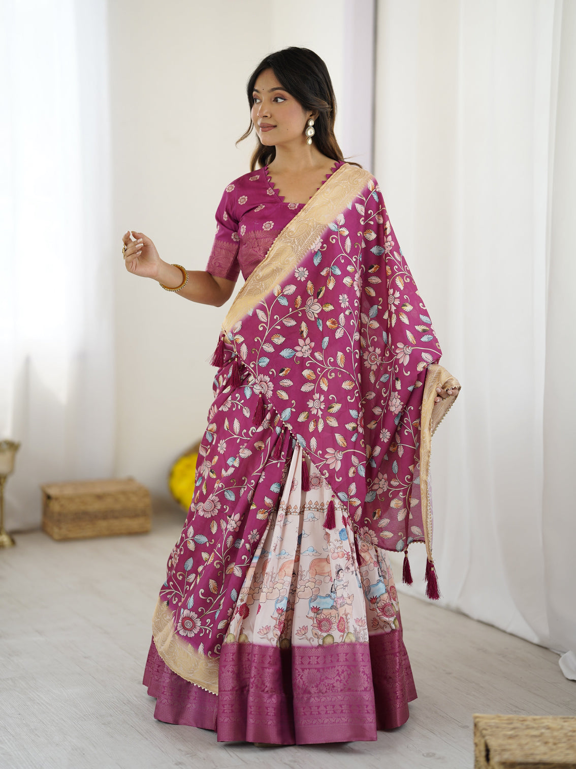 Elegant kalamkari lehenga in wine and peach with divine print and floral zari dupatta