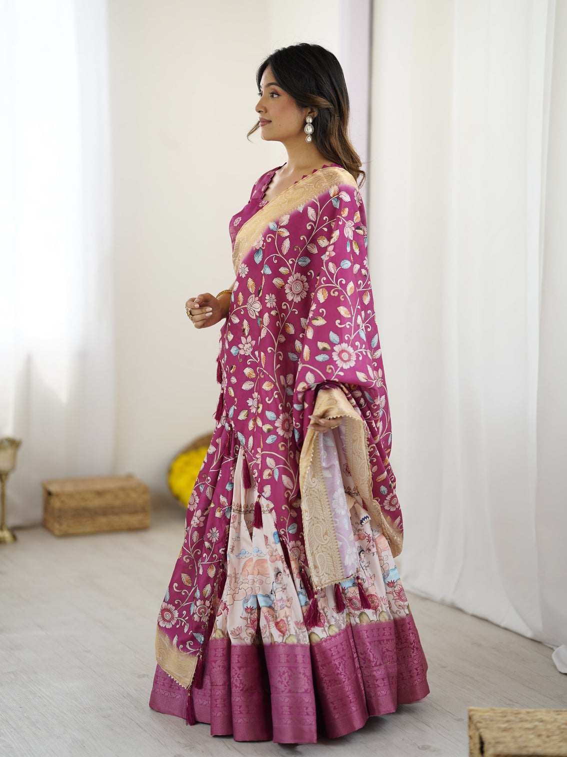 Elegant kalamkari lehenga in wine and peach with divine print and floral zari dupatta