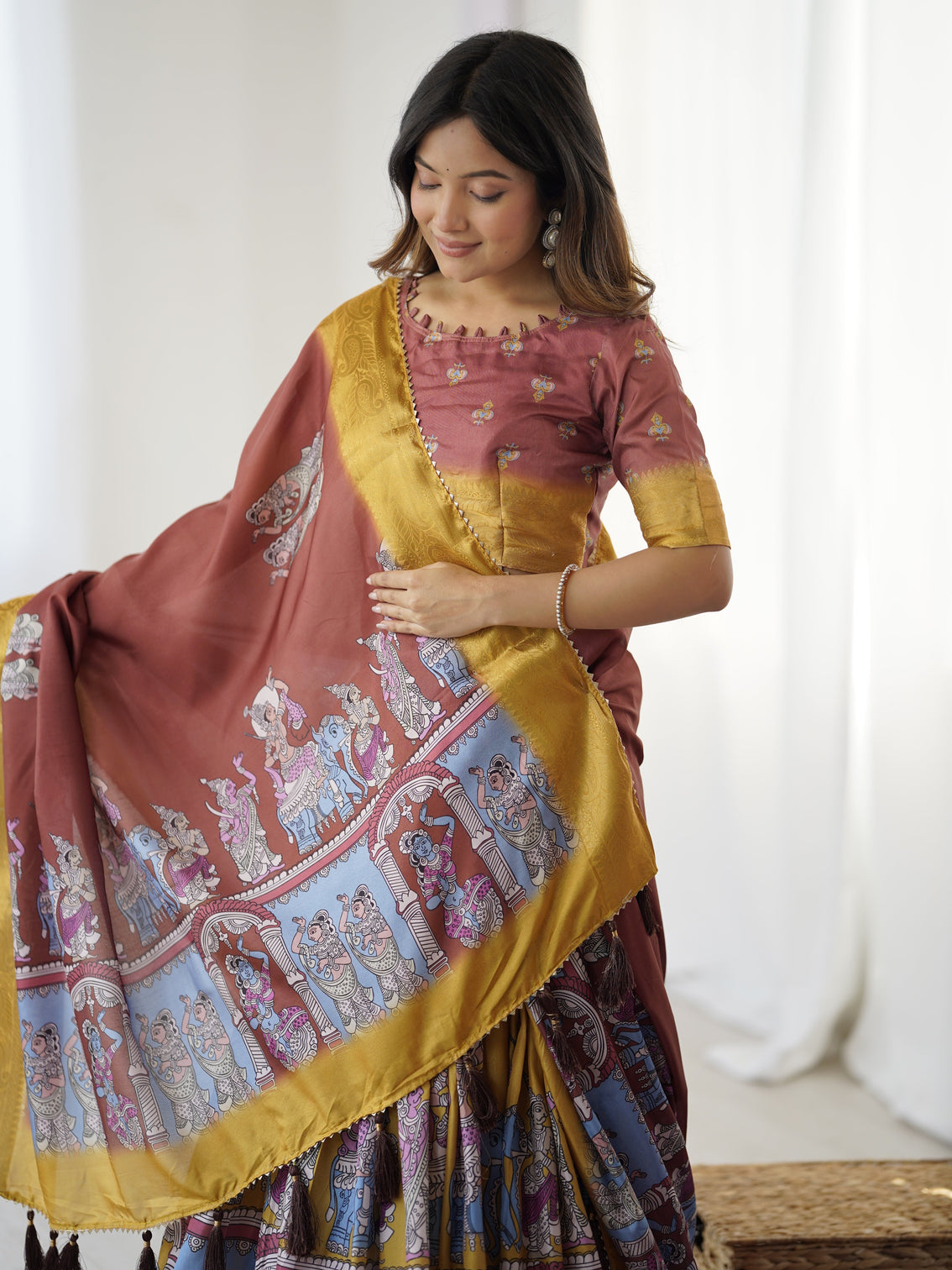 Elegant kalamkari lehenga in maroon and mustard with flared skirt and dupatta