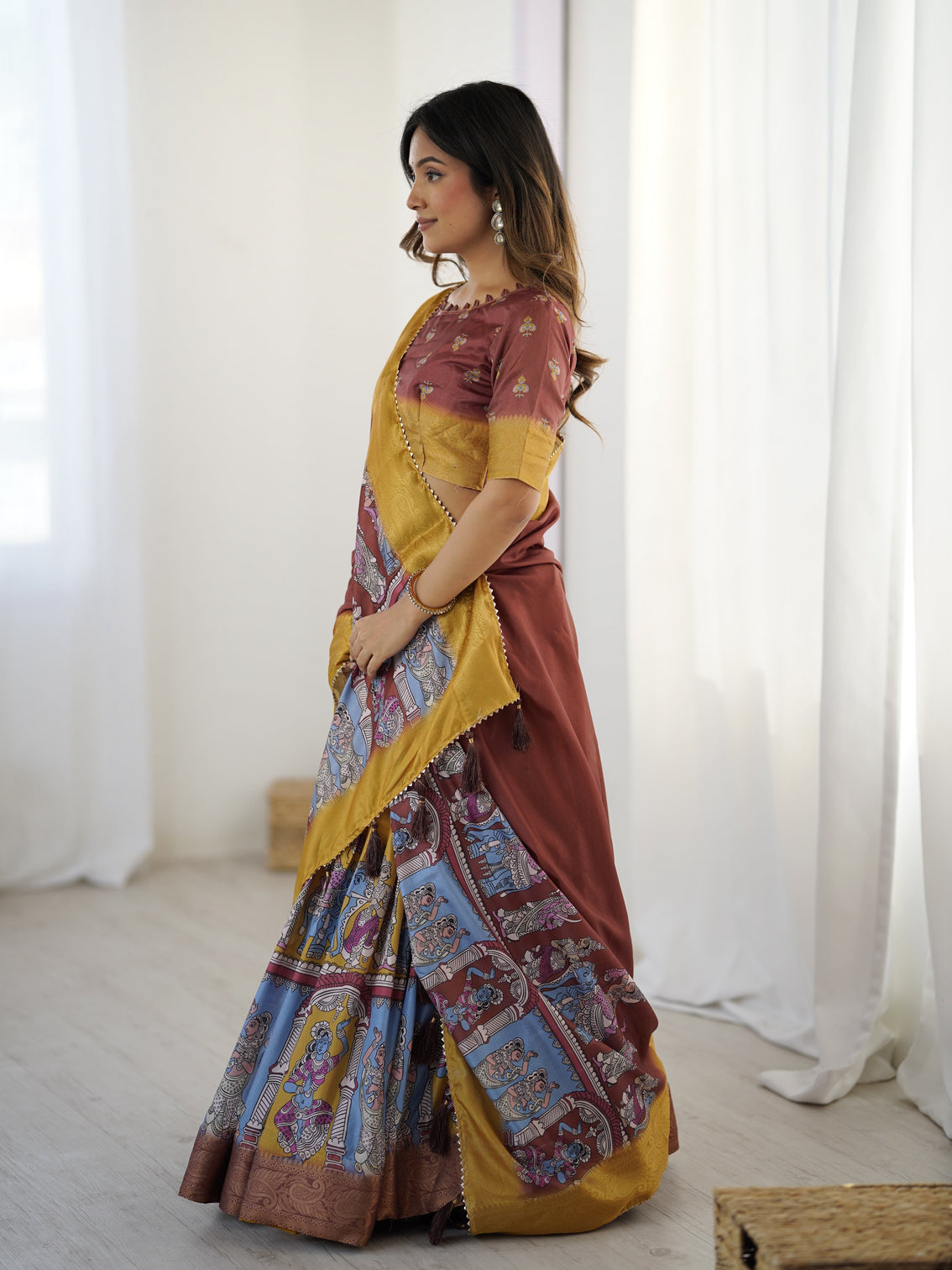 Elegant kalamkari lehenga in maroon and mustard with flared skirt and dupatta