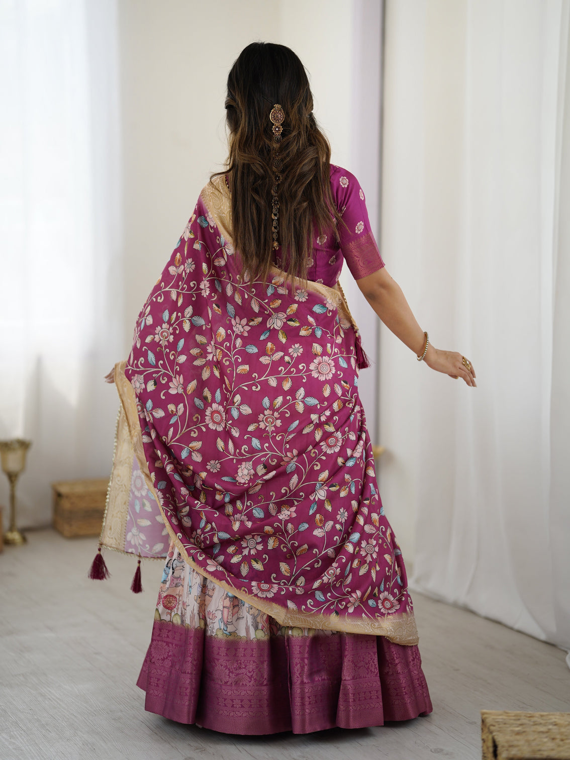 Elegant kalamkari lehenga in wine and peach with divine print and floral zari dupatta