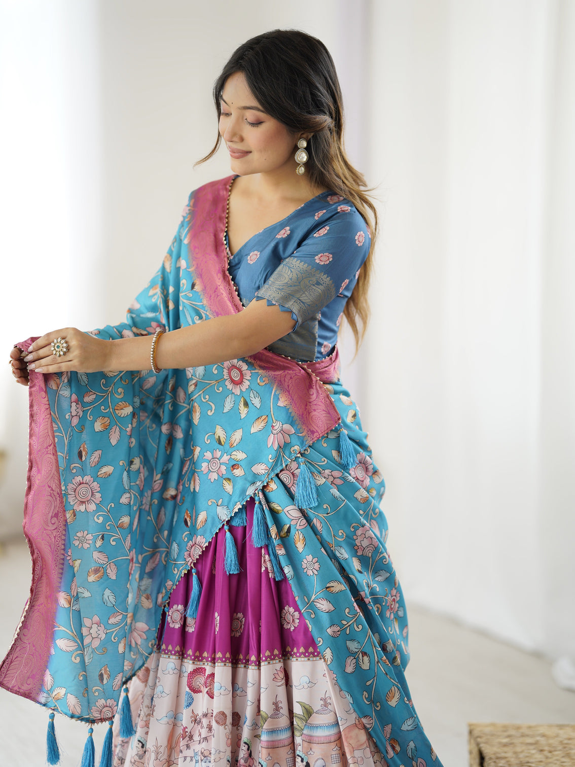 Peacock blue kalamkari lehenga with divine print and floral embroidered dupatta