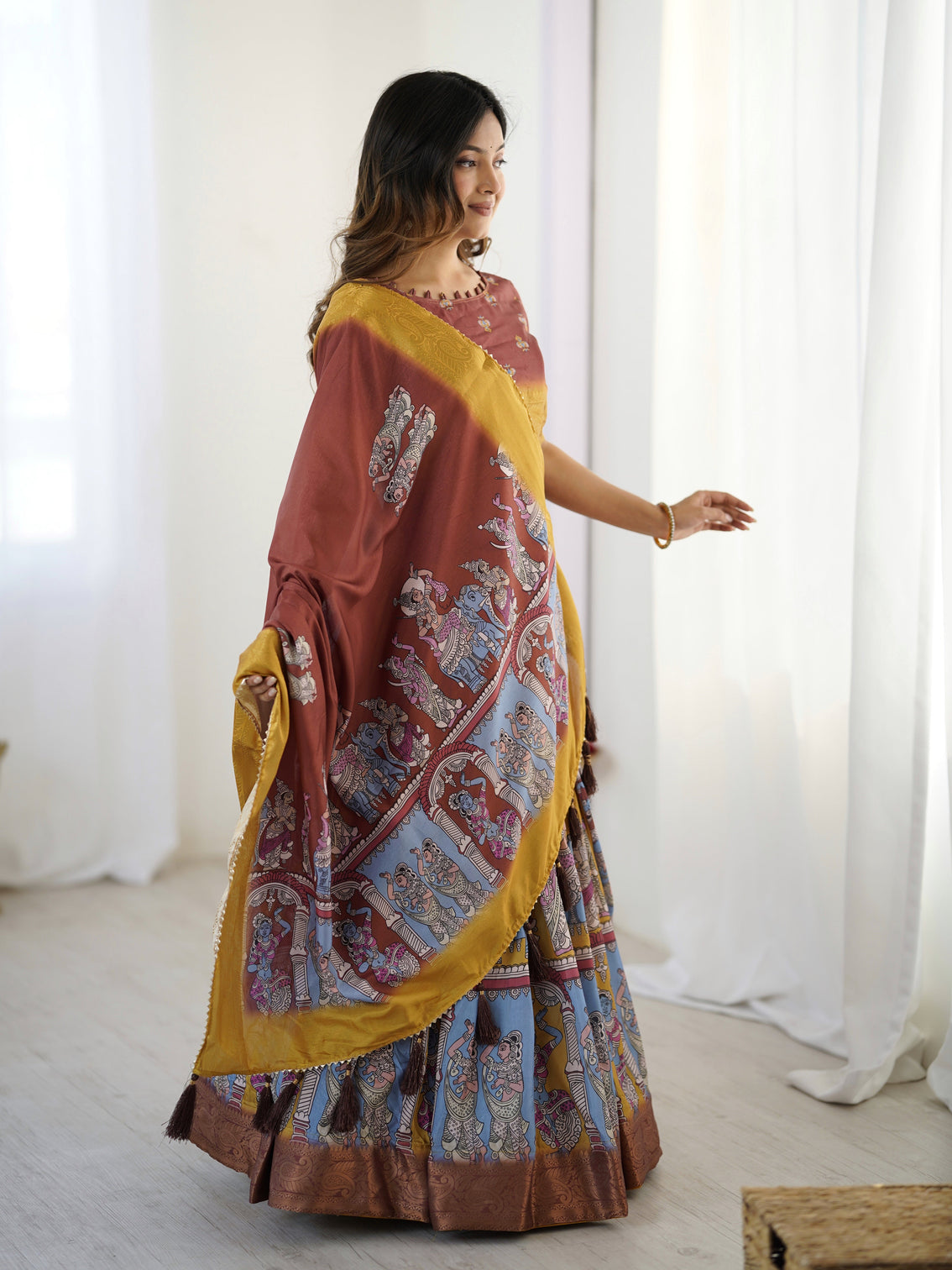 Elegant kalamkari lehenga in maroon and mustard with flared skirt and dupatta