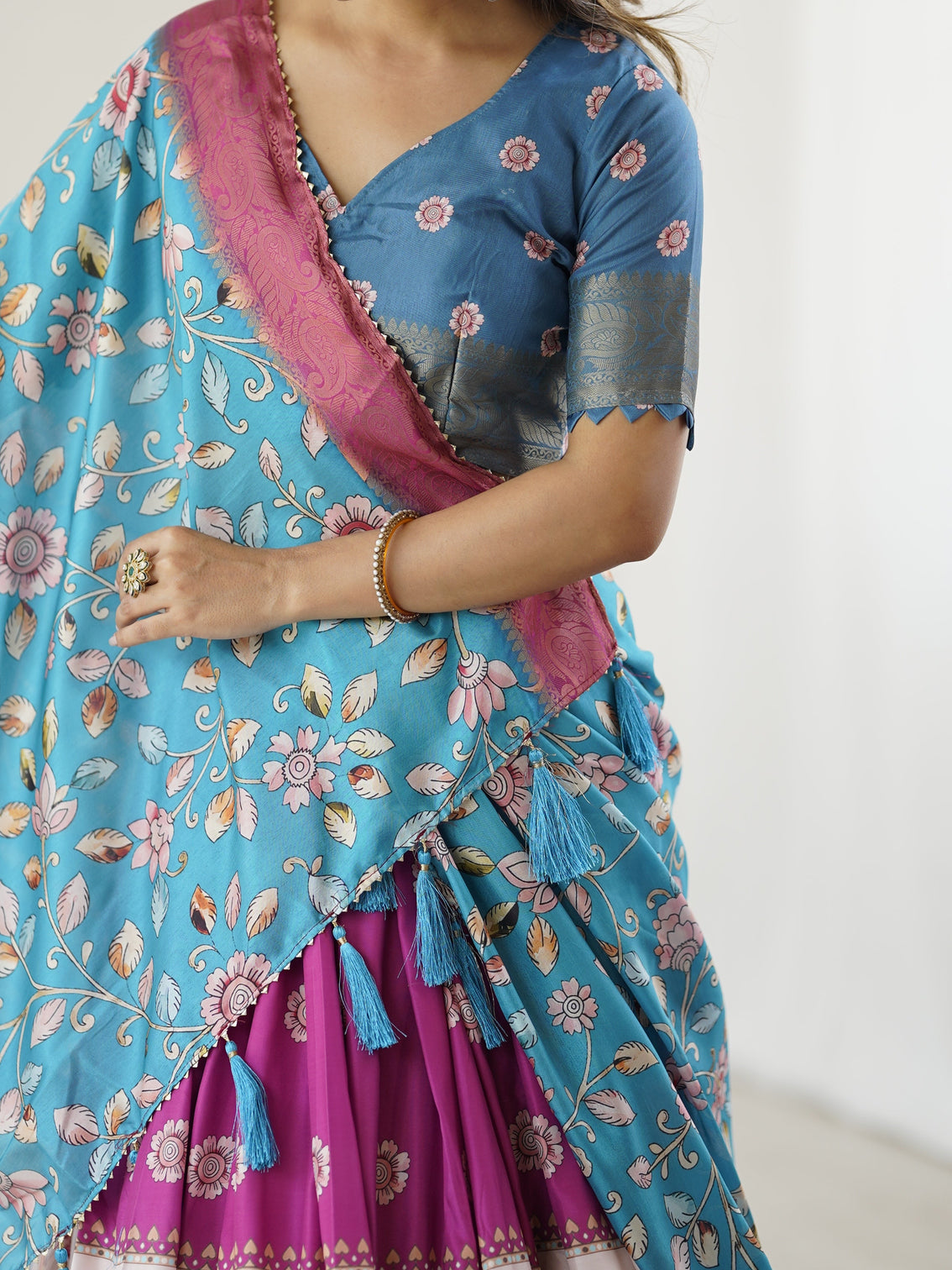 Peacock blue kalamkari lehenga with divine print and floral embroidered dupatta