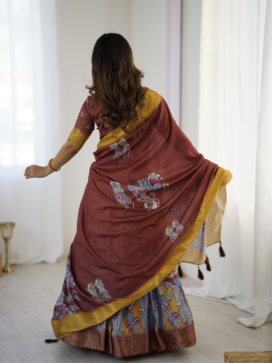 Elegant kalamkari lehenga in maroon and mustard with flared skirt and dupatta