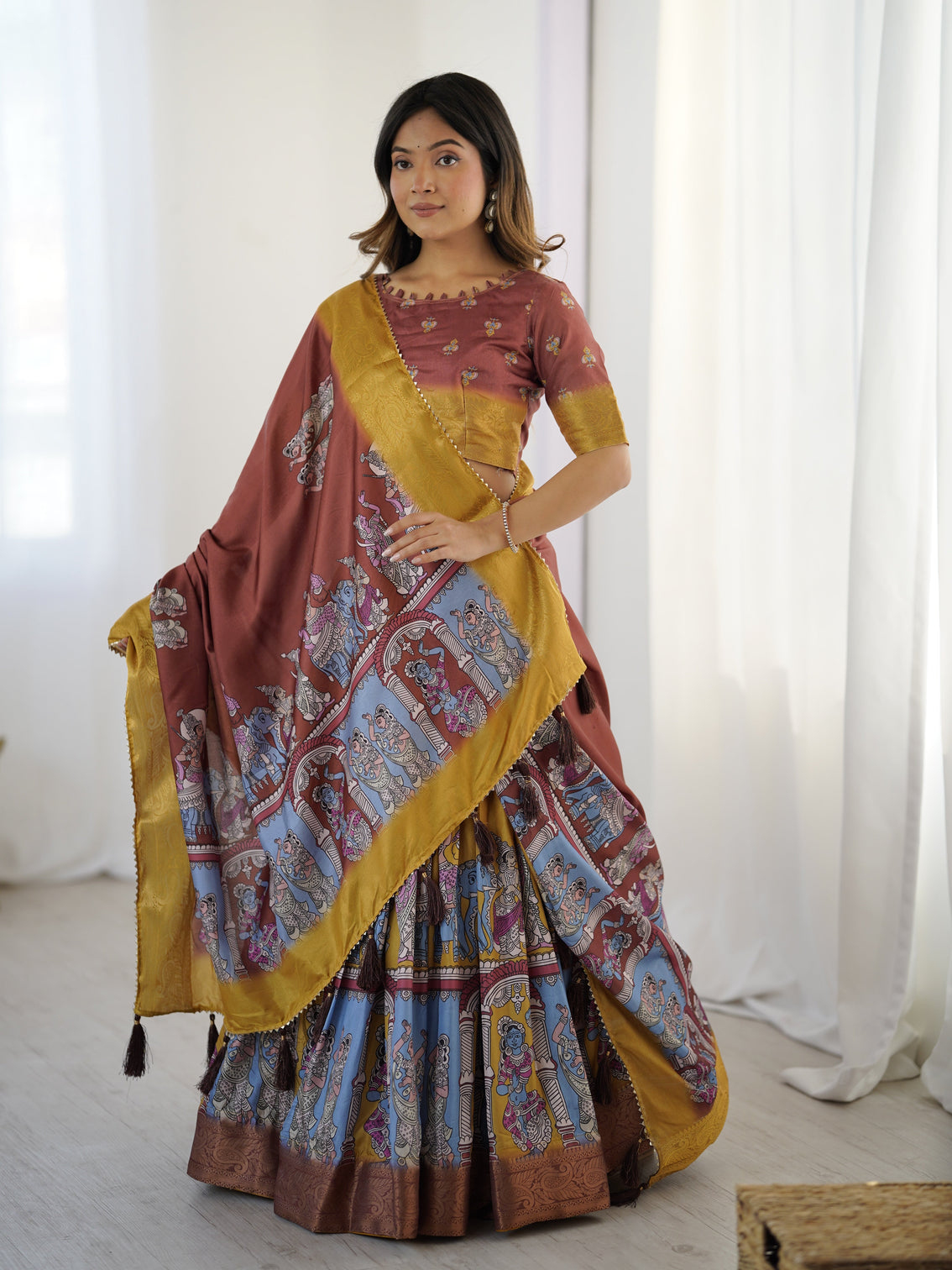Elegant kalamkari lehenga in maroon and mustard with flared skirt and dupatta