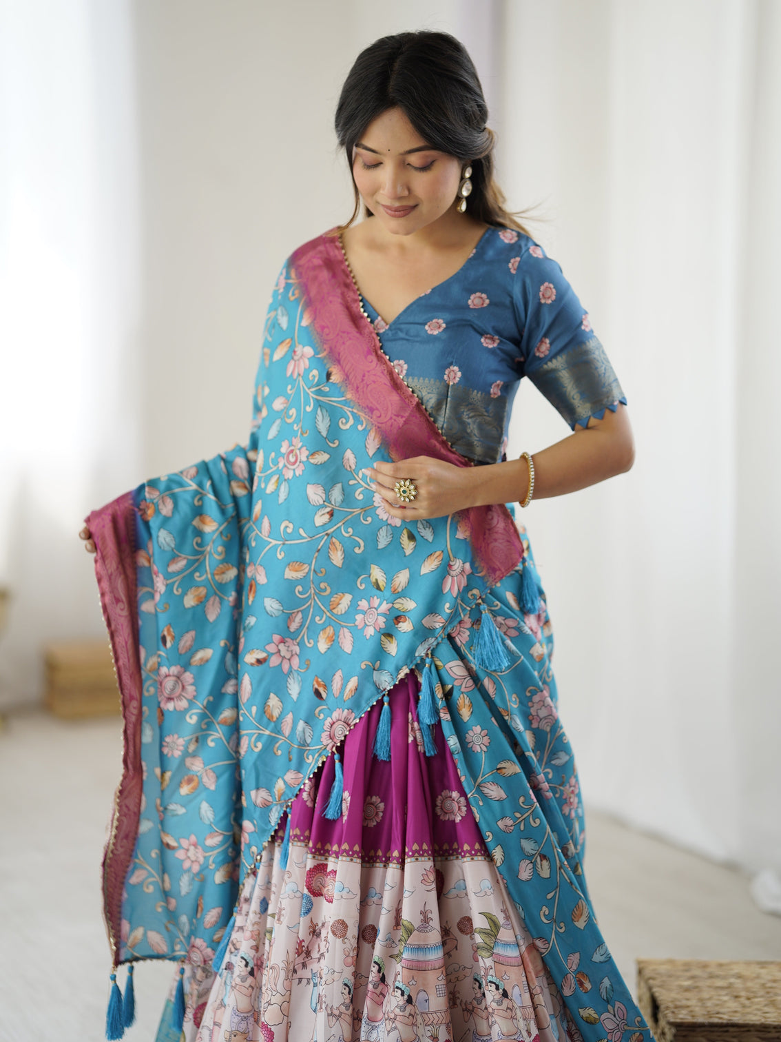 Peacock blue kalamkari lehenga with divine print and floral embroidered dupatta