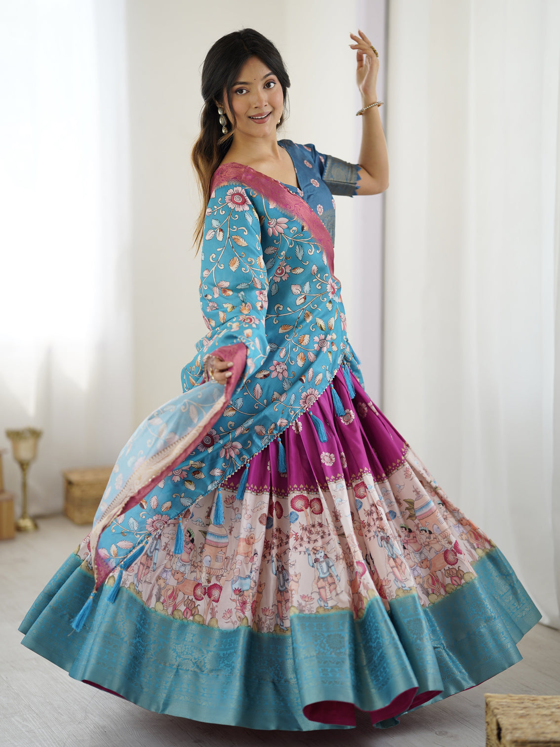 Peacock blue kalamkari lehenga with divine print and floral embroidered dupatta