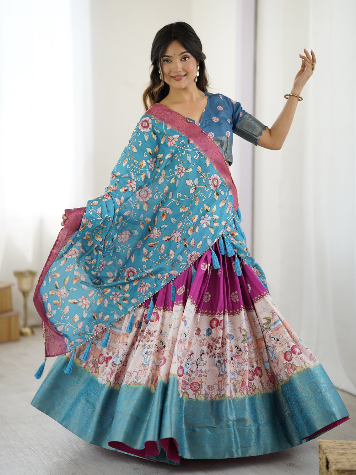 Peacock blue kalamkari lehenga with divine print and floral embroidered dupatta