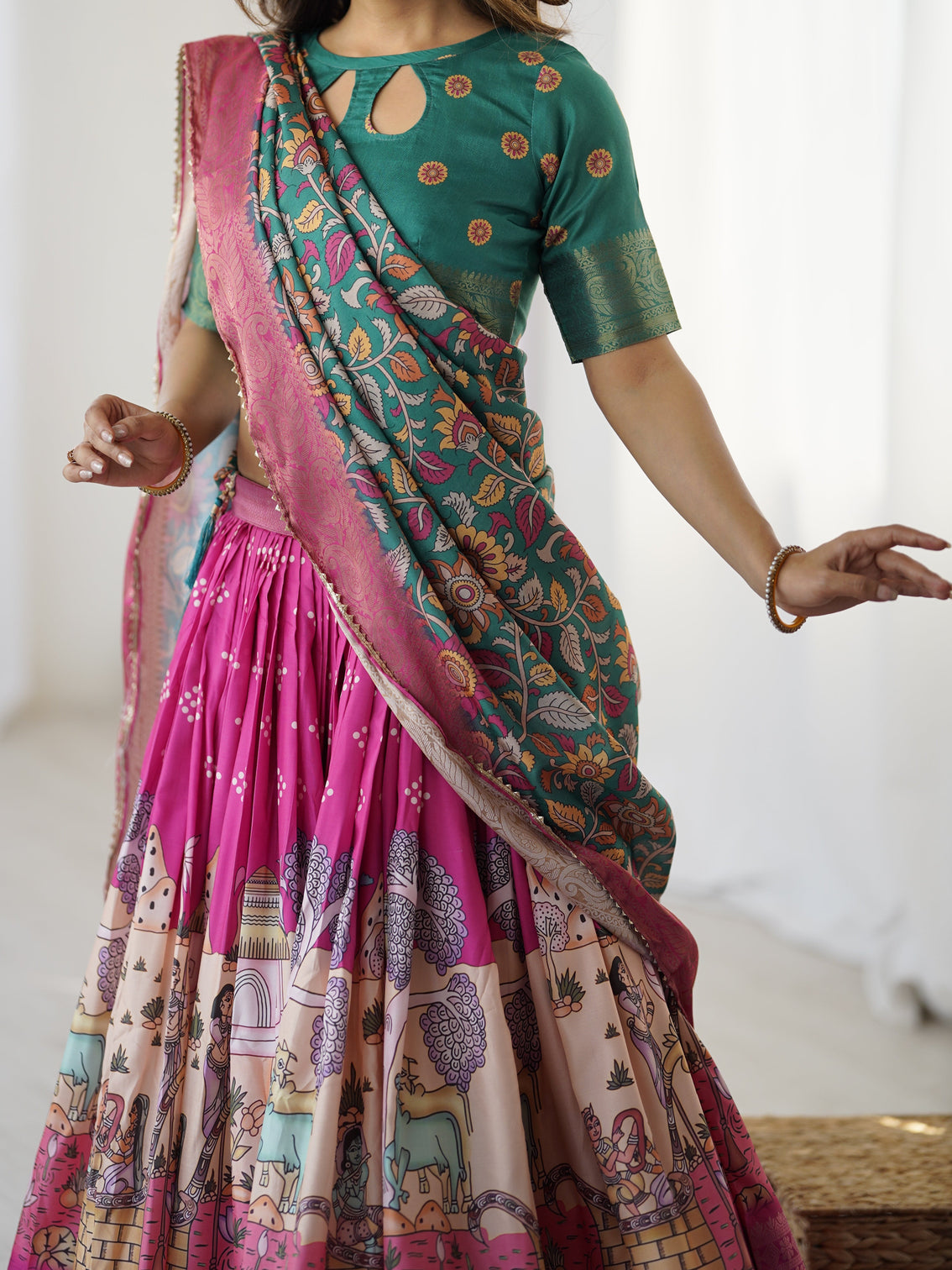 Elegant kalamkari lehenga in fuchsia pink and green with floral dupatta and story print skirt