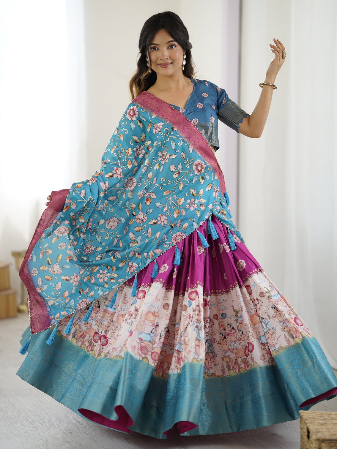 Peacock blue kalamkari lehenga with divine print and floral embroidered dupatta