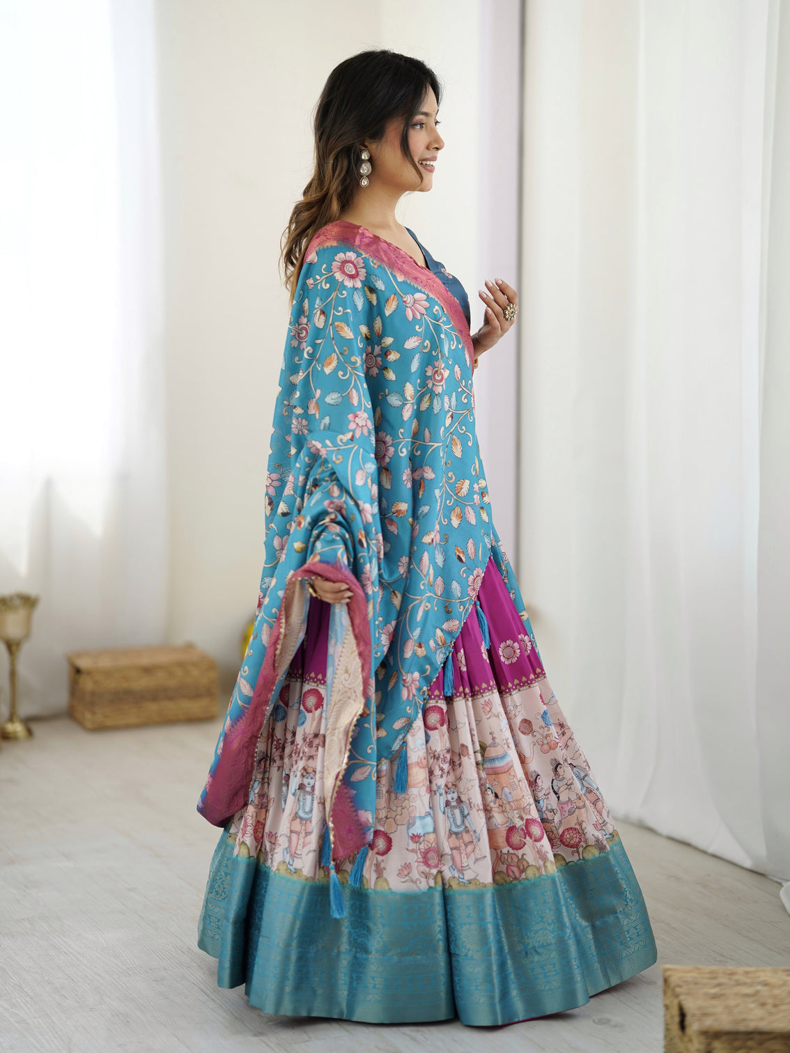 Peacock blue kalamkari lehenga with divine print and floral embroidered dupatta