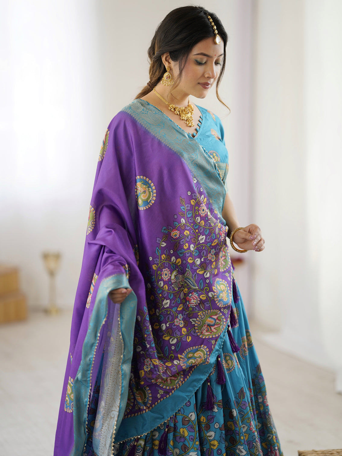 Turquoise blue purple kalamkari tussar silk lehenga with zari border tassel dupatta wedding festive wear
