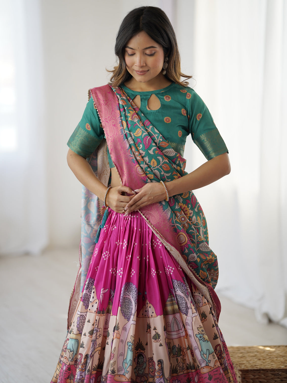 Elegant kalamkari lehenga in fuchsia pink and green with floral dupatta and story print skirt
