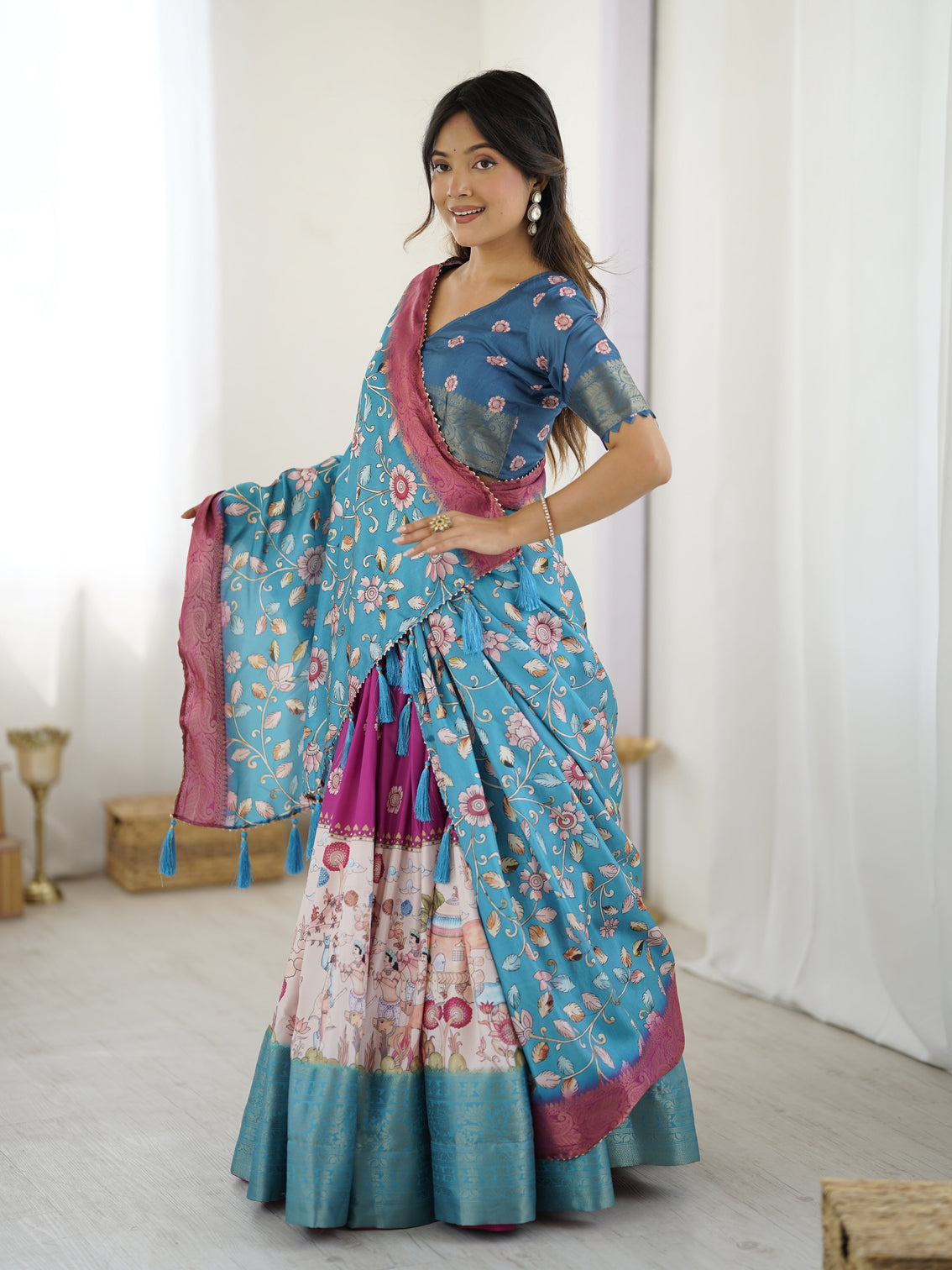 Peacock blue kalamkari lehenga with divine print and floral embroidered dupatta
