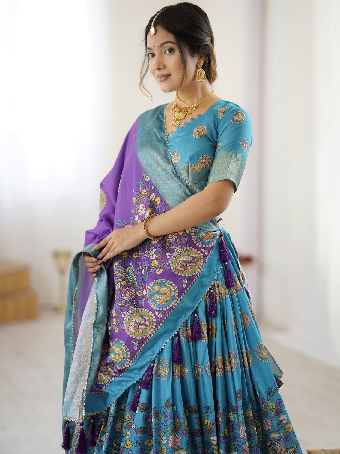 Turquoise blue purple kalamkari tussar silk lehenga with zari border tassel dupatta wedding festive wear