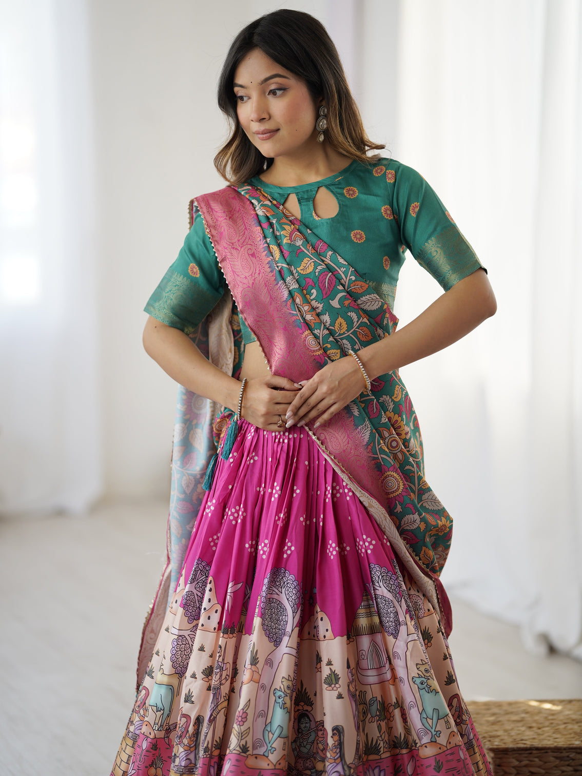 Elegant kalamkari lehenga in fuchsia pink and green with floral dupatta and story print skirt