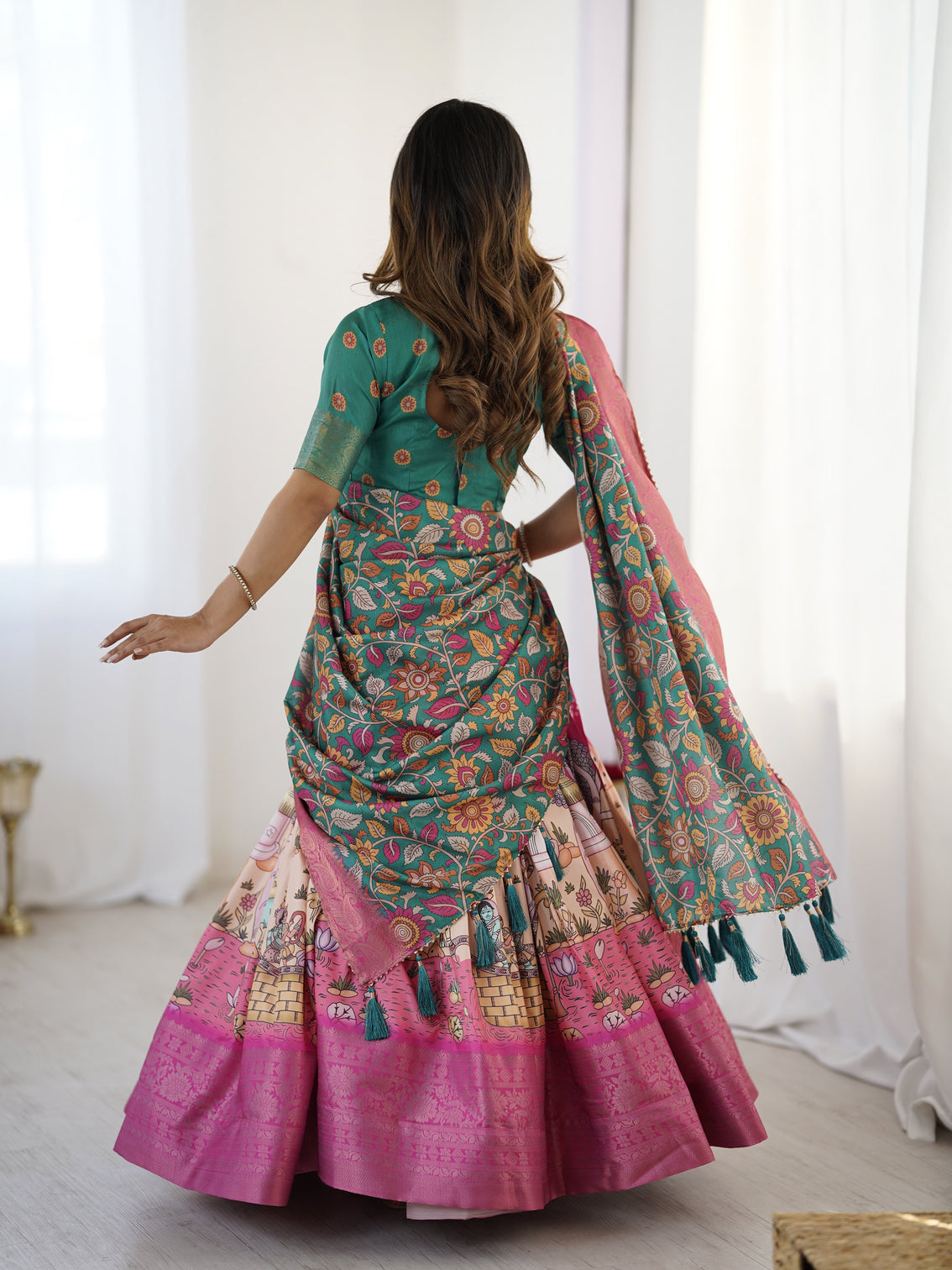 Elegant kalamkari lehenga in fuchsia pink and green with floral dupatta and story print skirt
