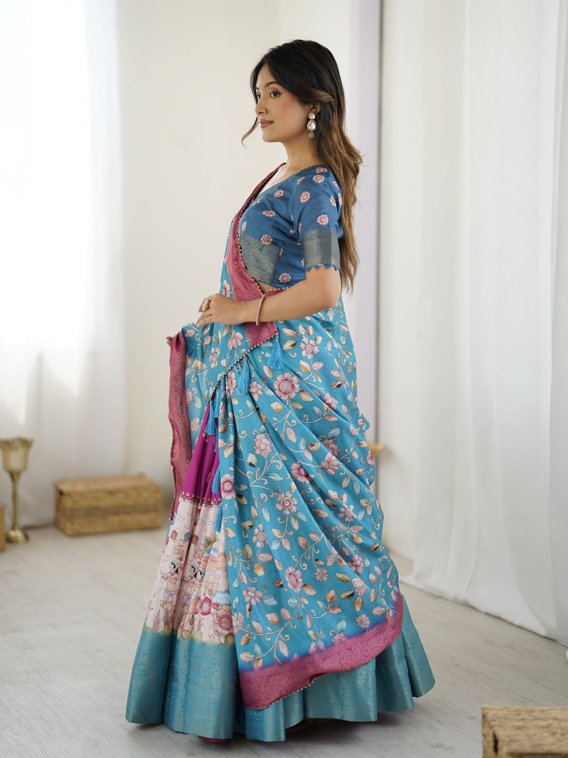 Peacock blue kalamkari lehenga with divine print and floral embroidered dupatta