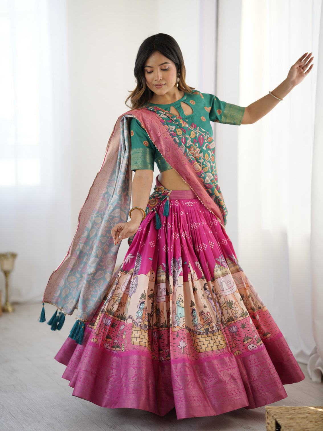 Elegant kalamkari lehenga in fuchsia pink and green with floral dupatta and story print skirt