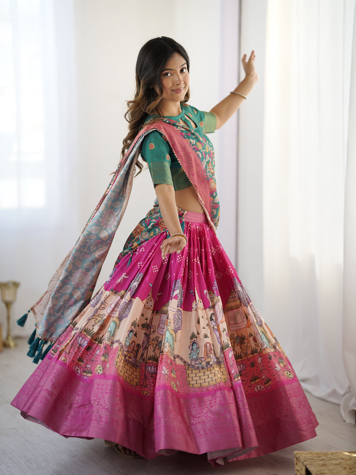 Elegant kalamkari lehenga in fuchsia pink and green with floral dupatta and story print skirt