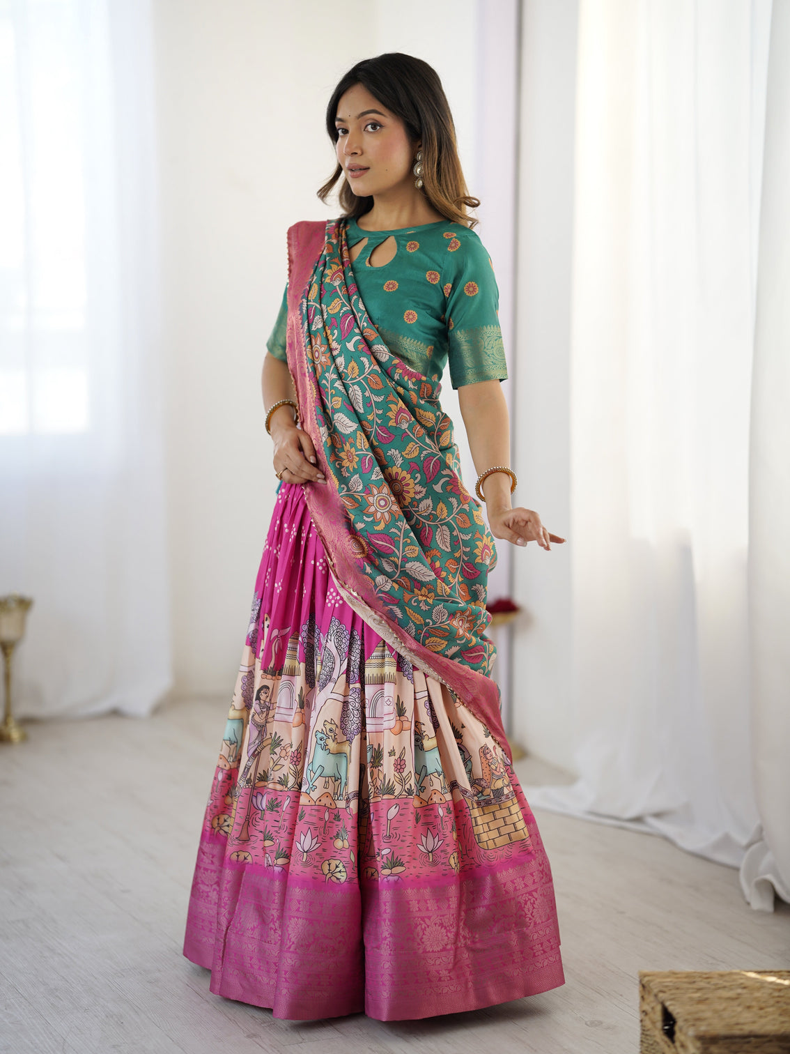 Elegant kalamkari lehenga in fuchsia pink and green with floral dupatta and story print skirt