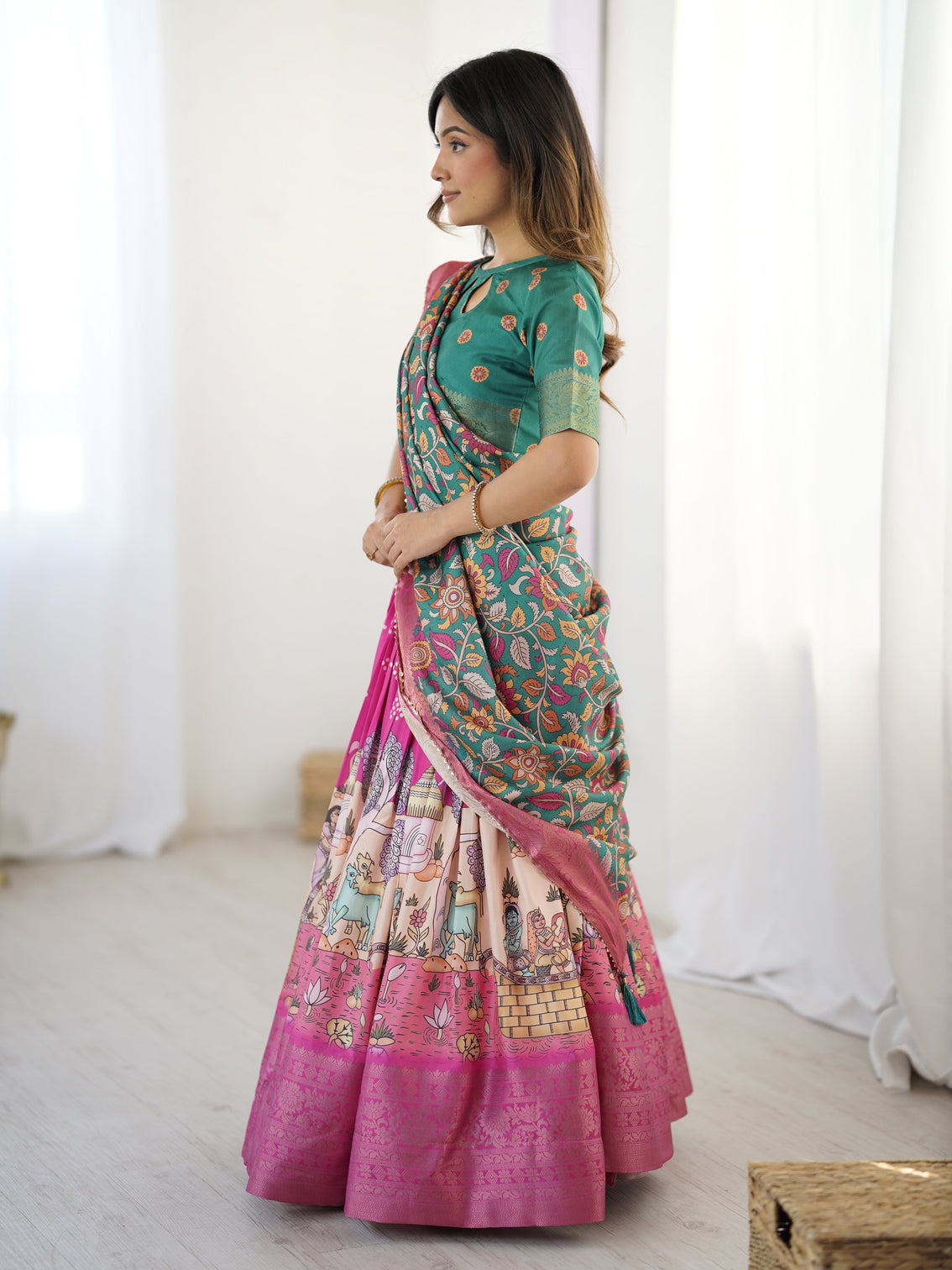 Elegant kalamkari lehenga in fuchsia pink and green with floral dupatta and story print skirt