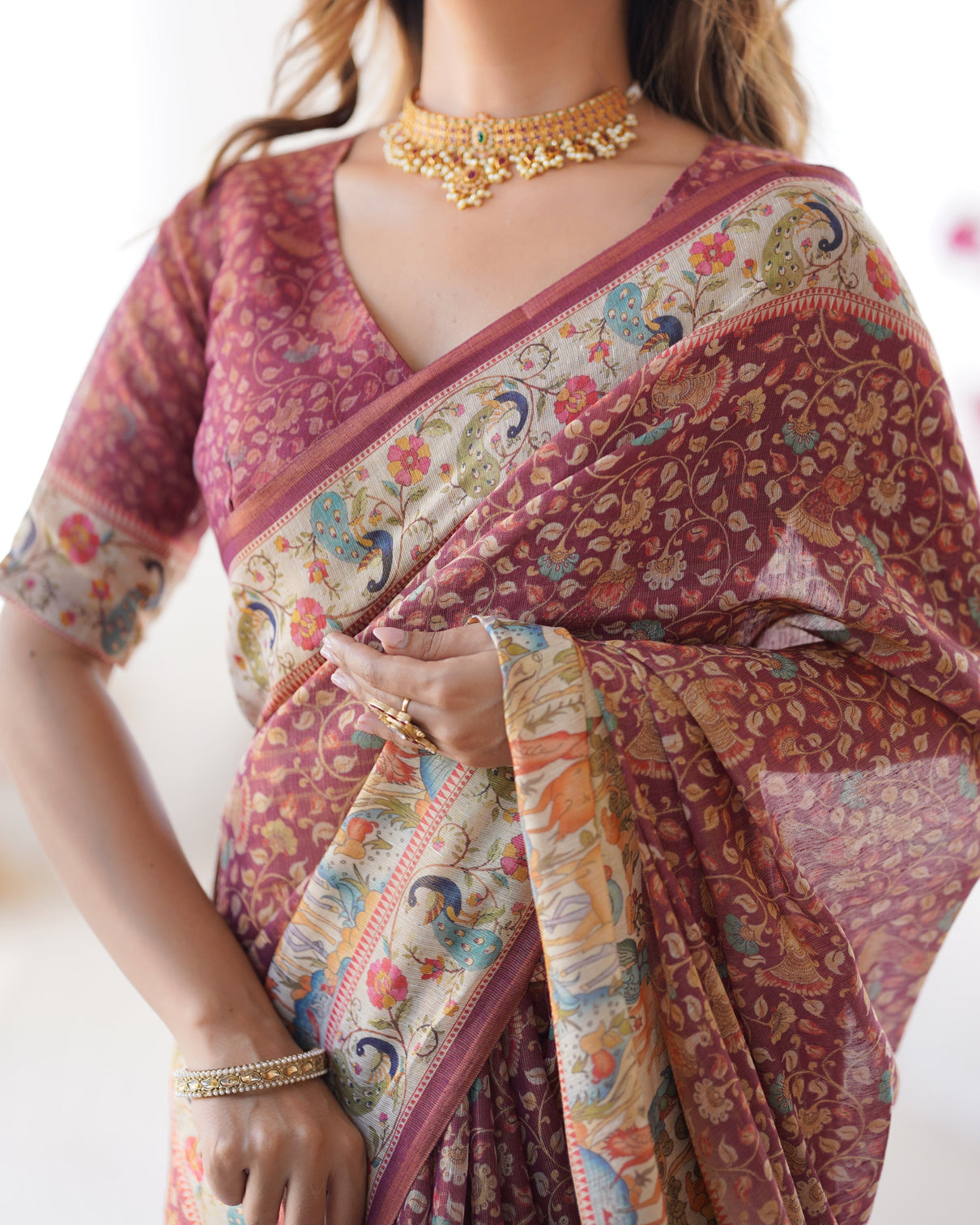 Maroon handloom cotton saree with all over floral print multicolor royal procession pallu