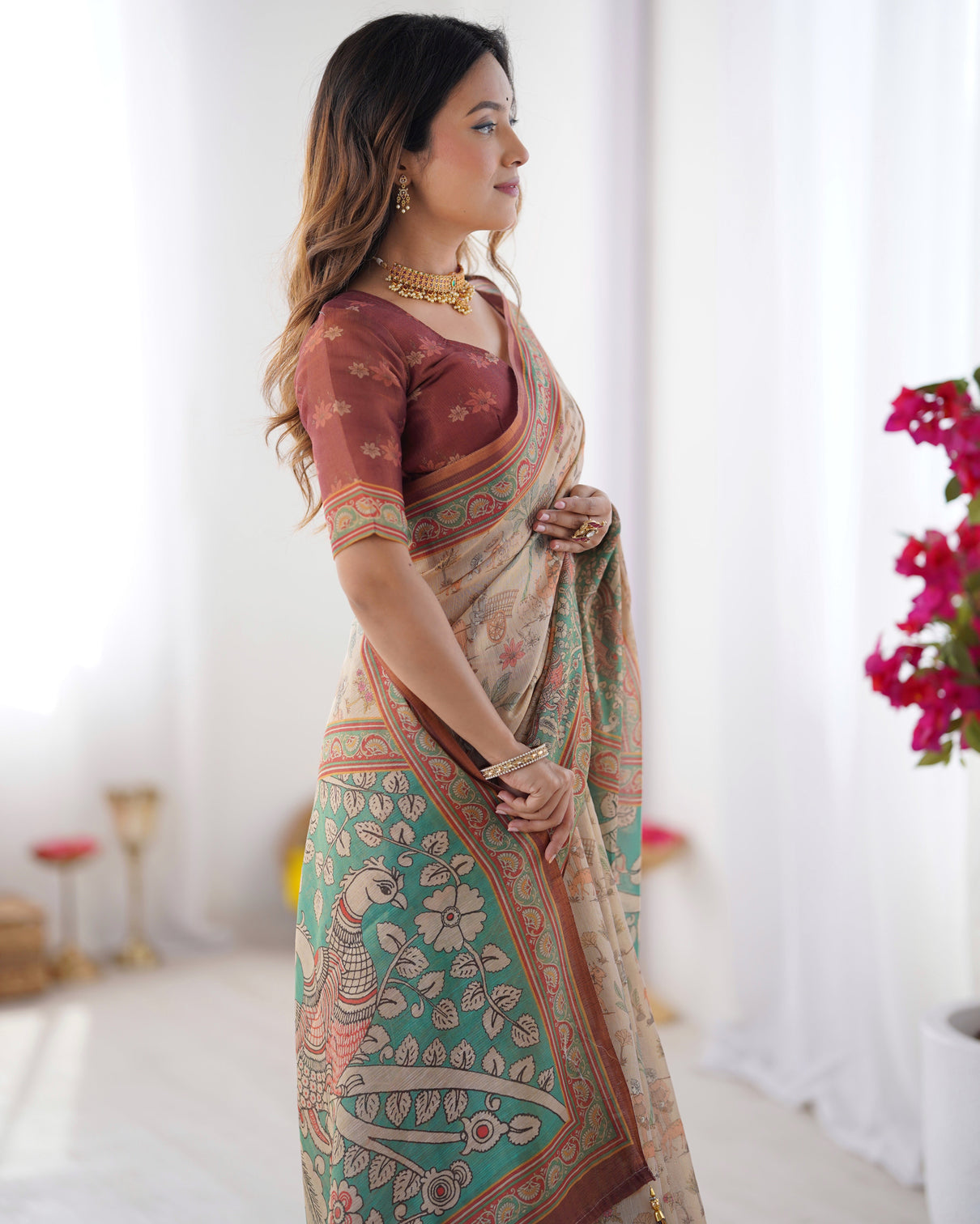 Beige green handloom cotton saree with village life print and majestic peacock pallu