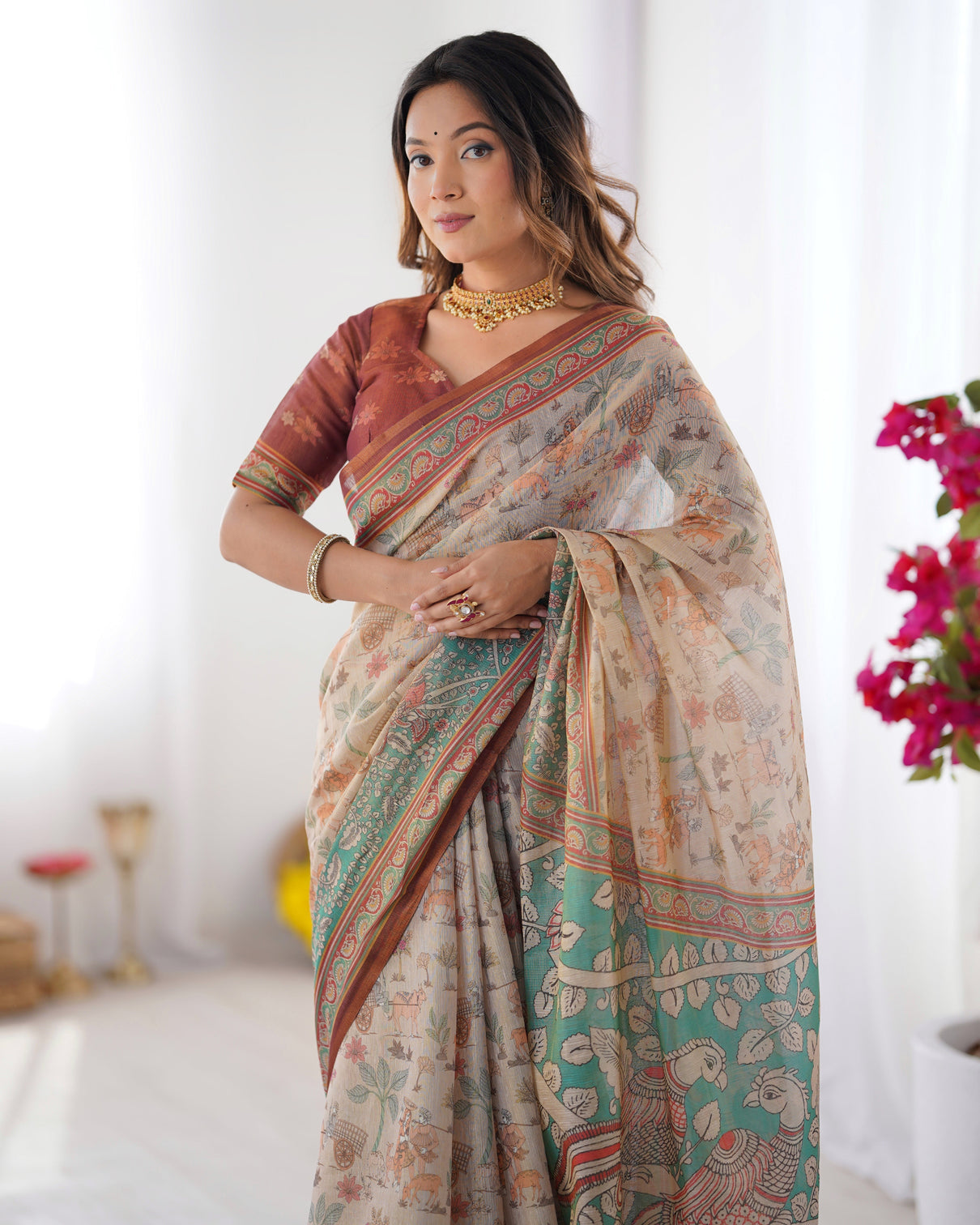 Beige green handloom cotton saree with village life print and majestic peacock pallu